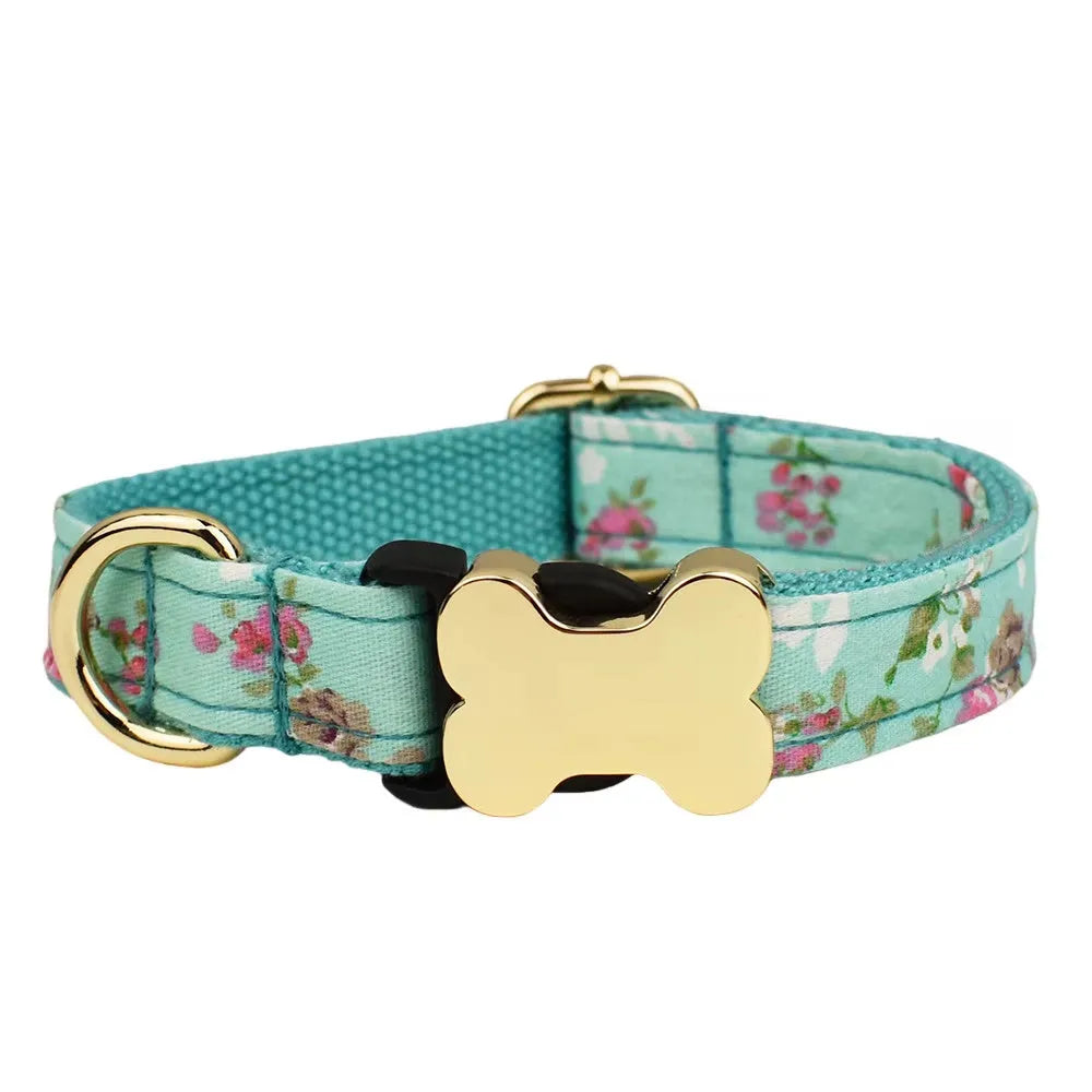 Flat nylon dog collar with printed grid pattern and a bone-shaped metal buckle on a white background.