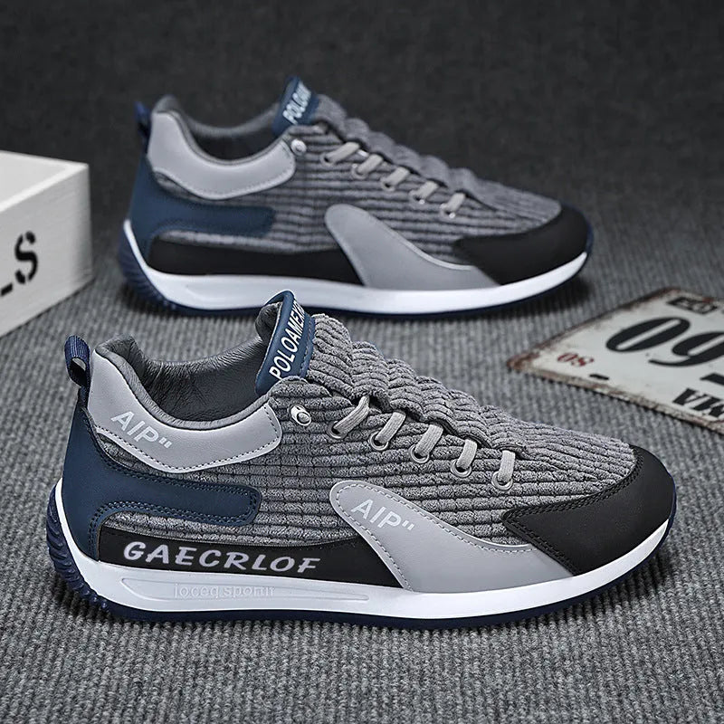 Men's grey and green mesh running shoes with lace-up closure and round toe design