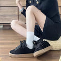Black retro low-top sneakers with waterproof platform sole and round toe