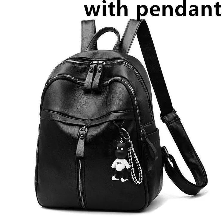 Black PU leather backpack with soft surface showing organised internal compartments and double shoulder straps