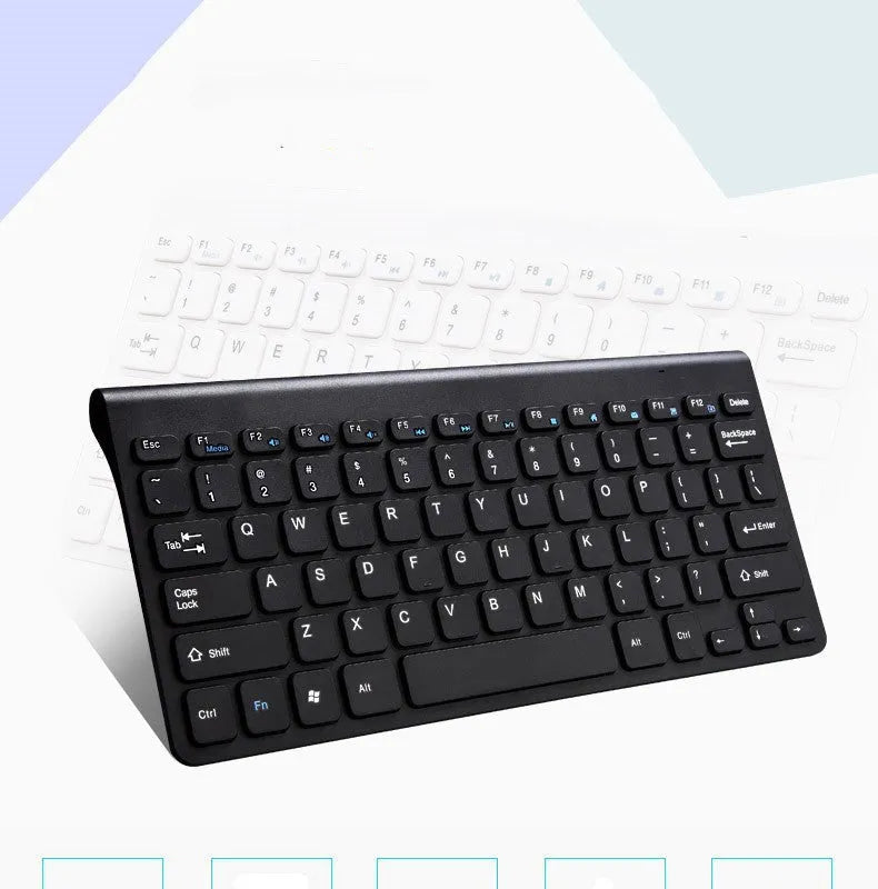 Black wireless keyboard and mouse set on wooden desk showing 2.4GHz wireless operation