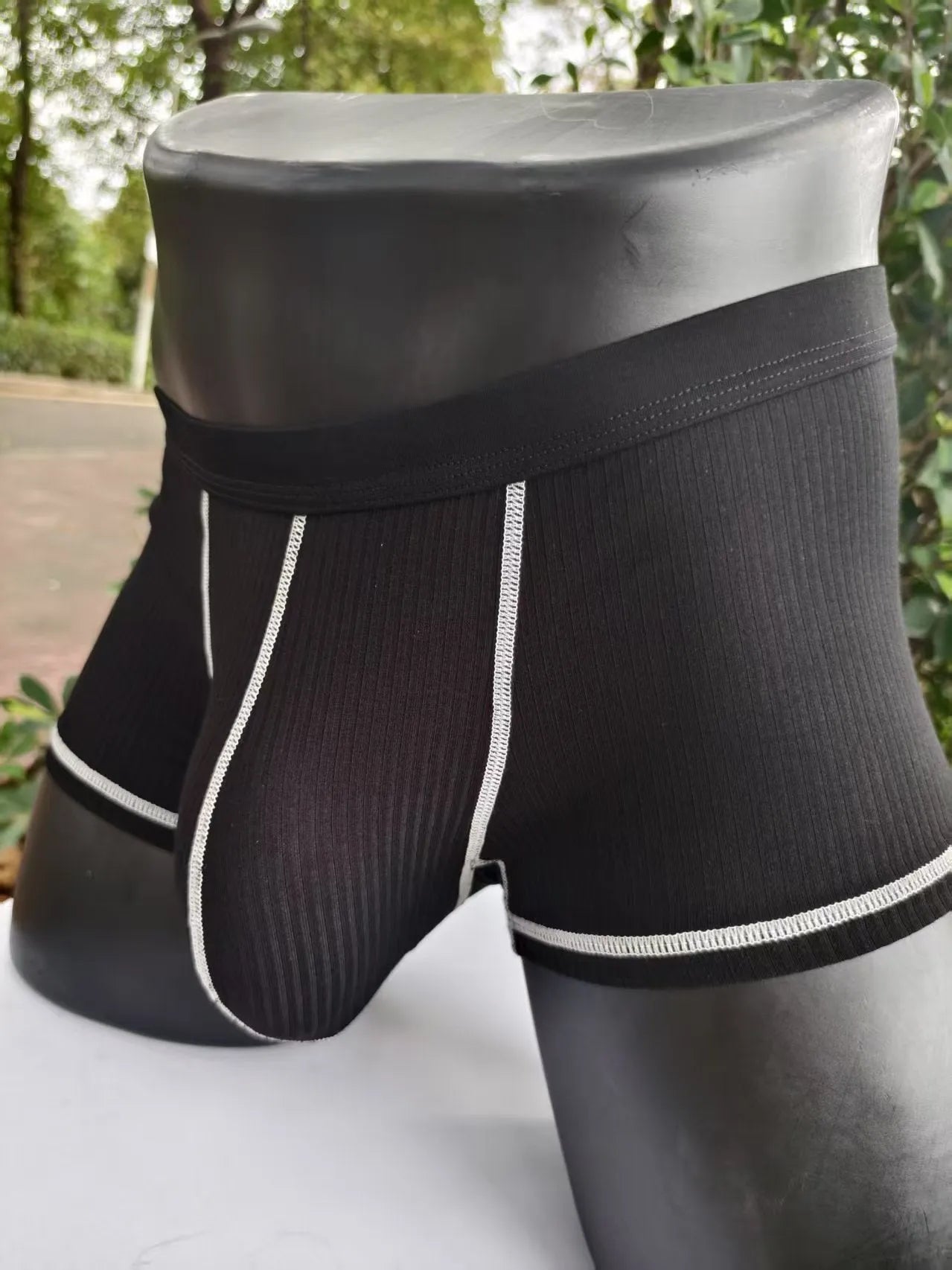 Men's solid colour thin fit boxers showing breathable fabric and body shaping design.