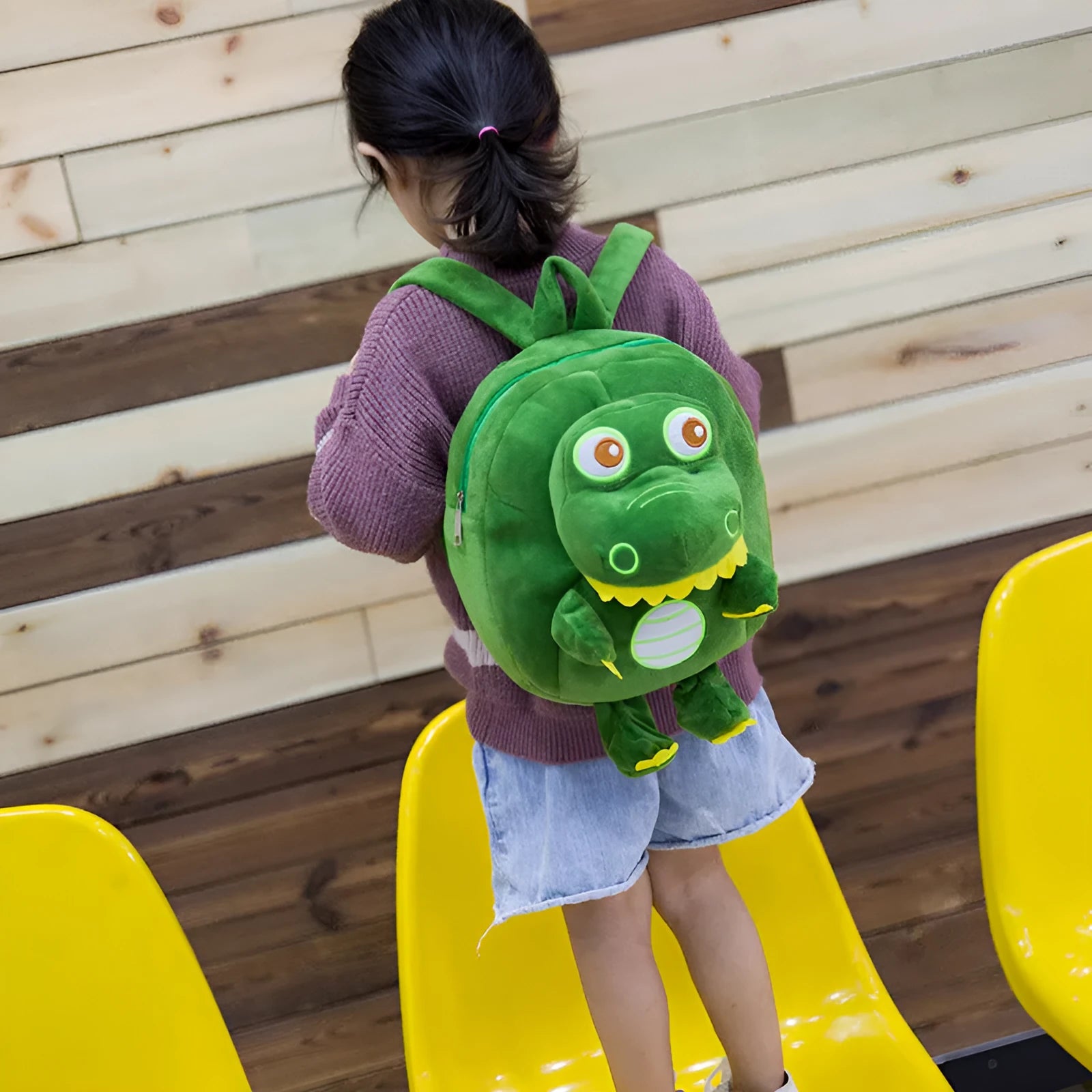 Soft blue dinosaur plush backpack for children with embroidery and a soft handle