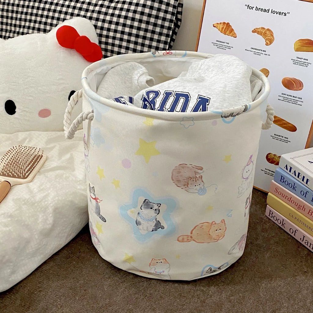 Foldable cotton laundry basket in decorative pattern options including Good Night Bear and Mint Green Western Highland