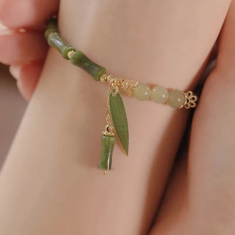 Handmade Chinese style glass women's bracelet featuring bamboo joint design elements.