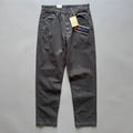 A pair of men's straight leg casual trousers in khaki colour on a mid-grey background.