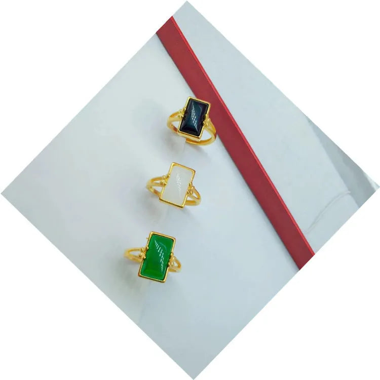 Adjustable brass gold-plated ring with gemstone inlays in black, green, or white colour options