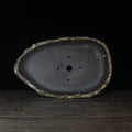 Handmade purple clay flower pot with traditional ceramic finish and drainage hole