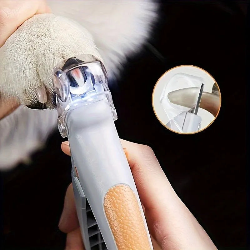 Yellow LED pet nail trimmer with magnifying glass, showing the cutting head and ergonomic handle.