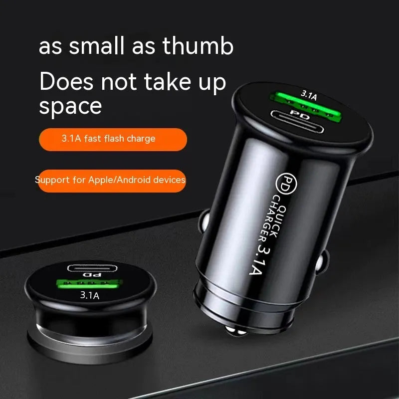 Black dual USB car charger plugged into vehicle 12V socket with phone charging