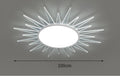 Modern round aluminium LED ceiling lamp with remote control on a white ceiling.