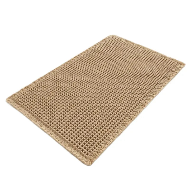 Square checkered pattern bathroom carpet on tiled floor in light grey colour.