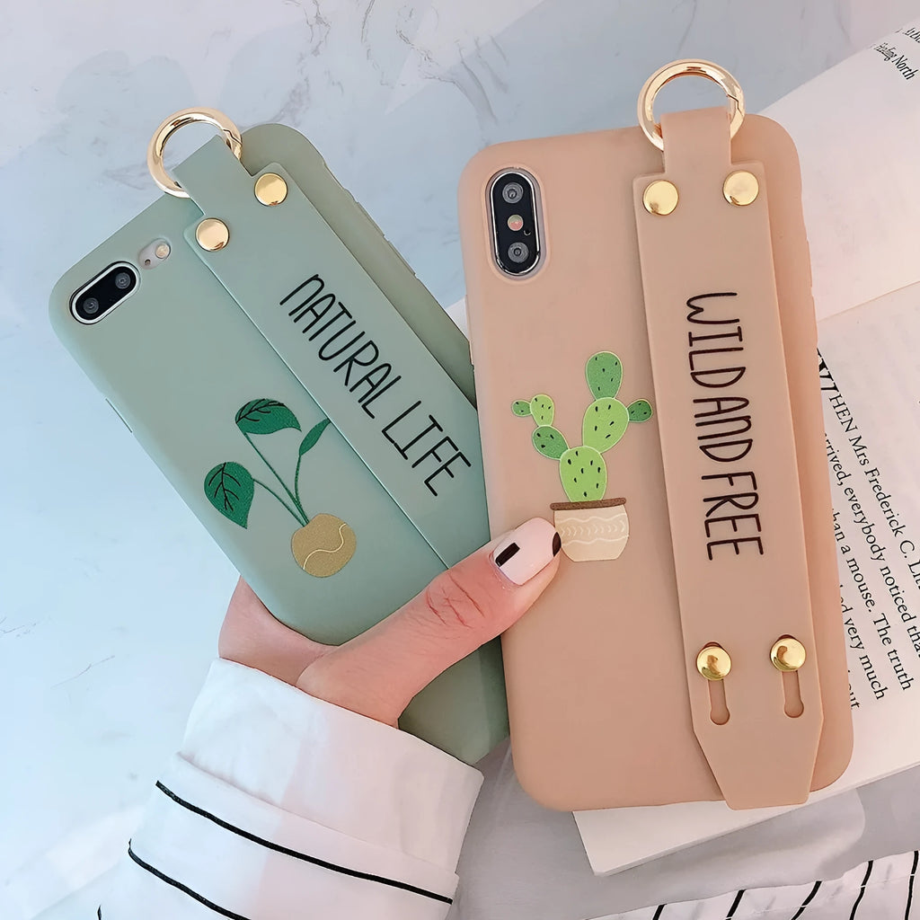 Green graffiti design phone case with a detachable silicone wristband, shown fitted on an iPhone.