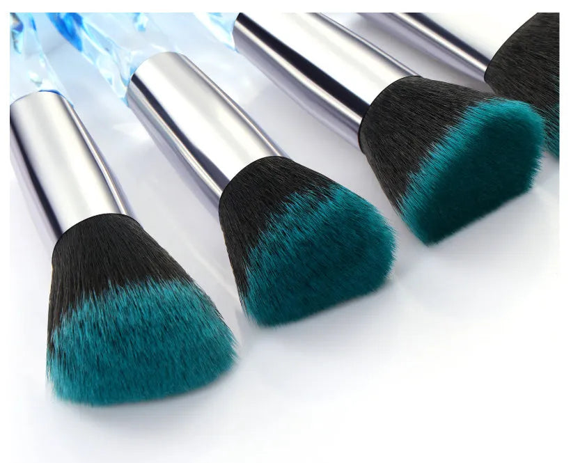 Ten clear crystal-handled foundation brushes with artificial fibre bristles in black, blue, red, and yellow colours