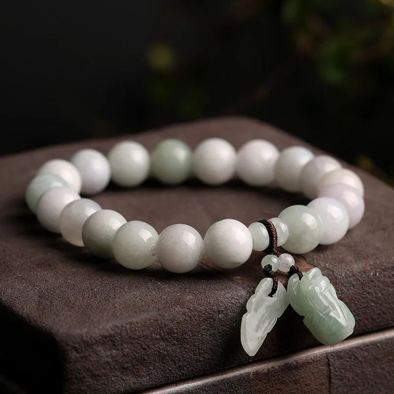 Natural emerald jade bracelet with hanging Maitreya Buddha charm and geometric design