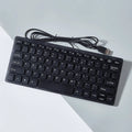 Wired USB mini keyboard in four colour options showing compact design and 1.3m cable