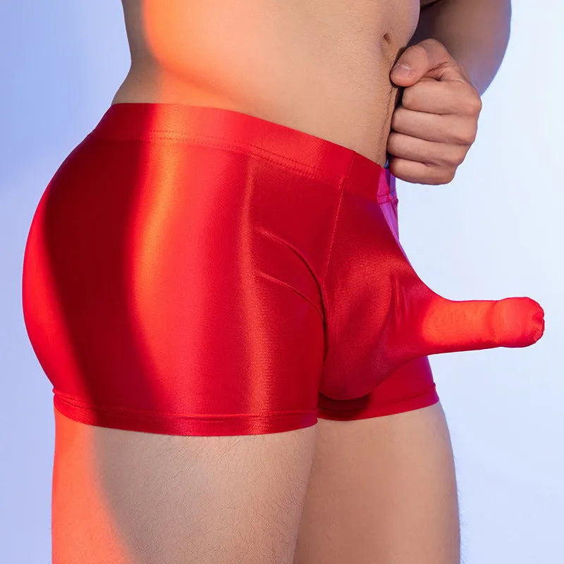 Men's red elephant print boxer shorts on a mid-waist mannequin, showing seamless construction.