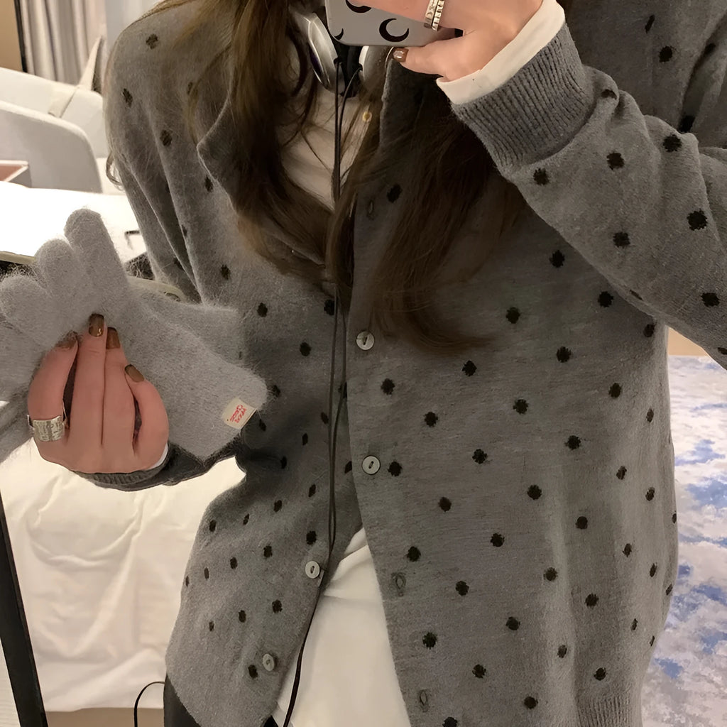 Women's grey dot knitted cardigan with crocheted flower detail and long sleeves