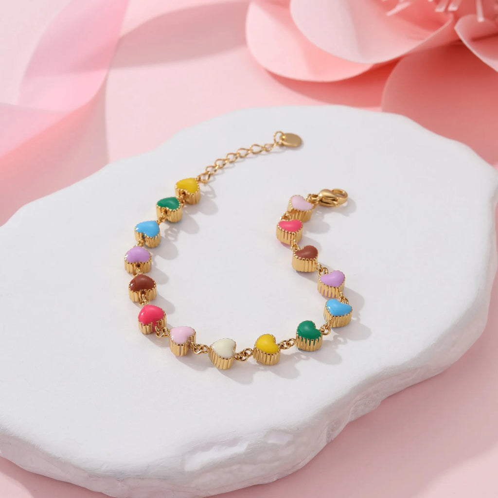 Gold or steel tone stainless steel love heart pendant bracelet for women.