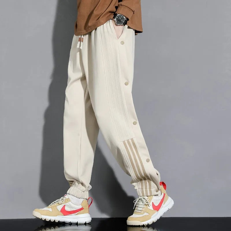Men's loose fit cotton blend sweatpants with ankle ties and drawstring waistband in black colour