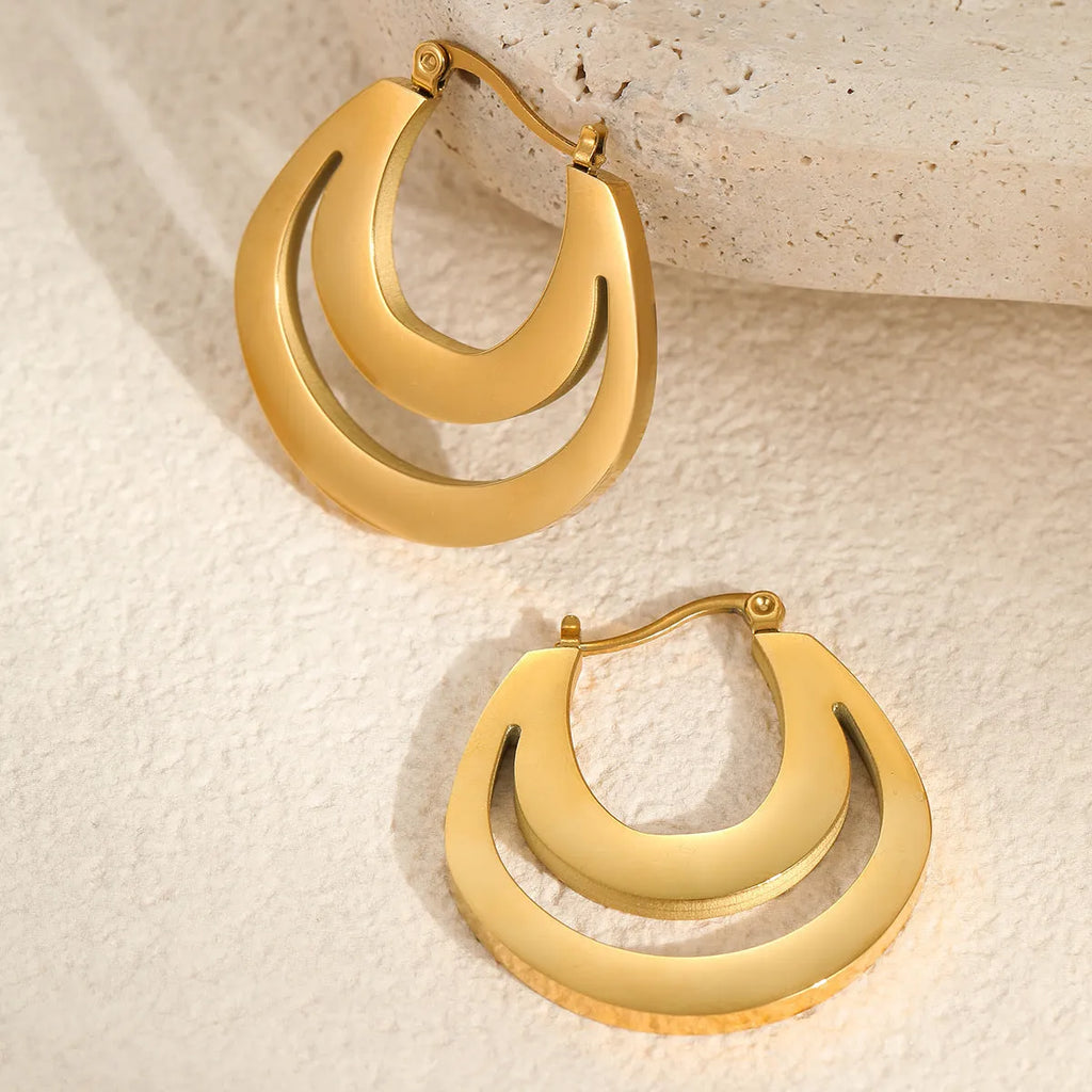 Geometric French earrings with round ring elements in gold and steel colour options