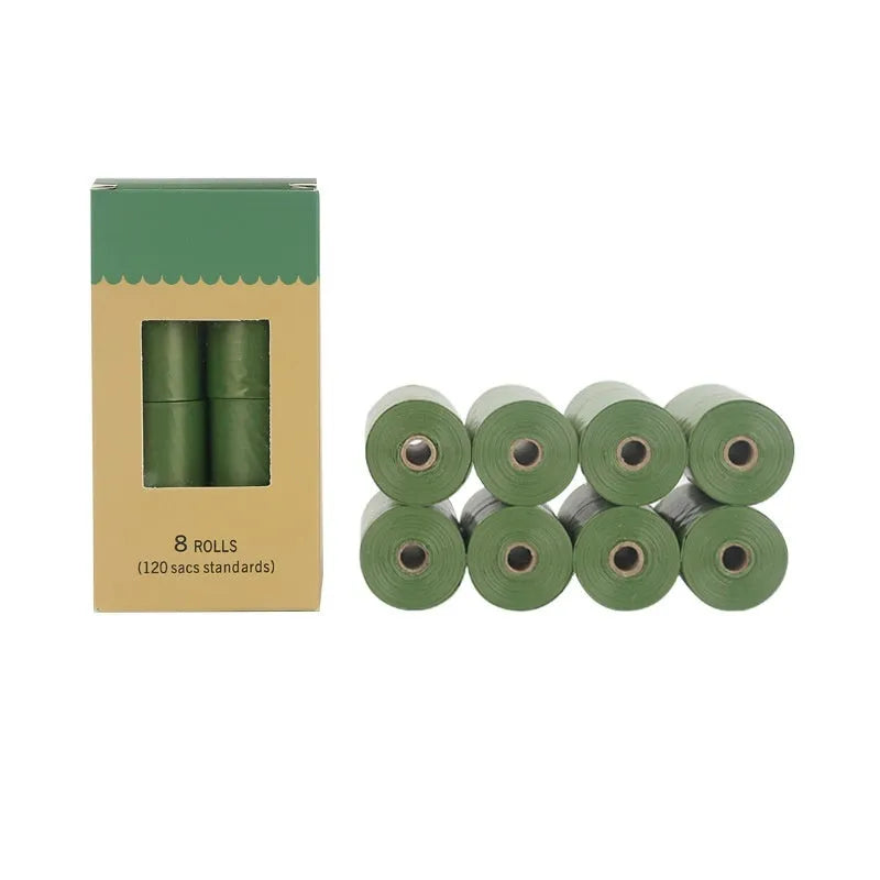 EPI degradable thickened pet waste bags on a roll, showing green colour variant next to a dispenser.