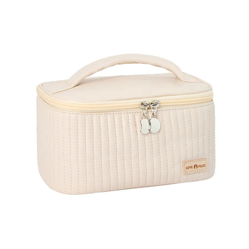 Structured open-top women's makeup bag in PU leather, shown in a solid colour.