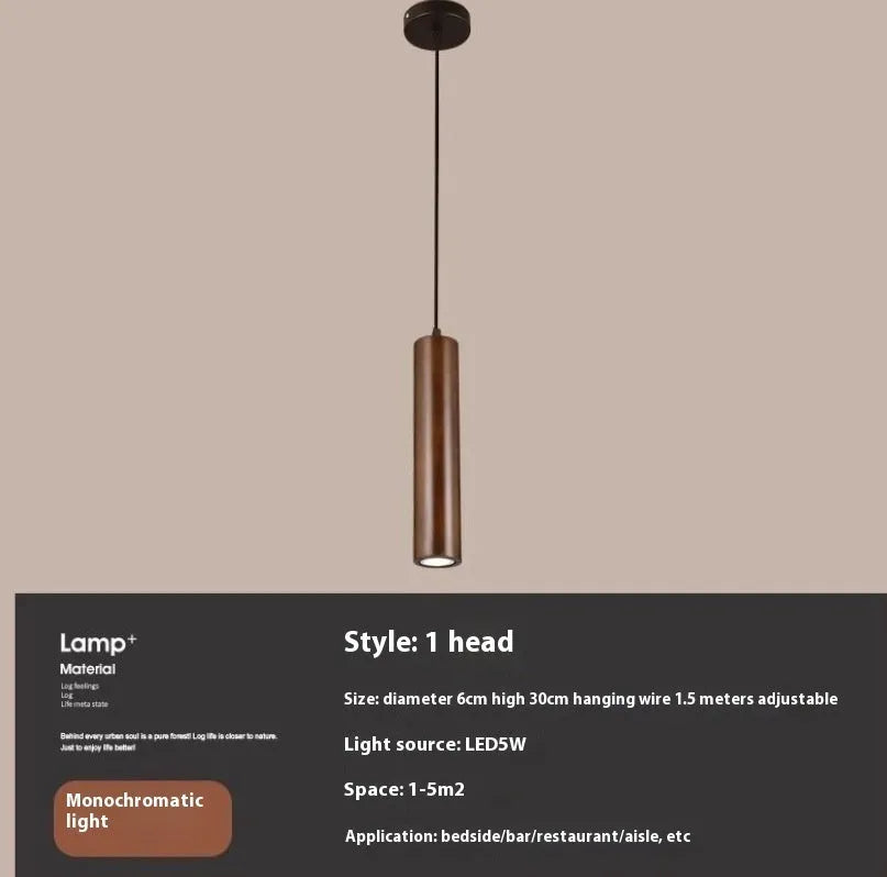 Solid wood Japanese style long chandelier with three warm light droplights in a modern bedroom