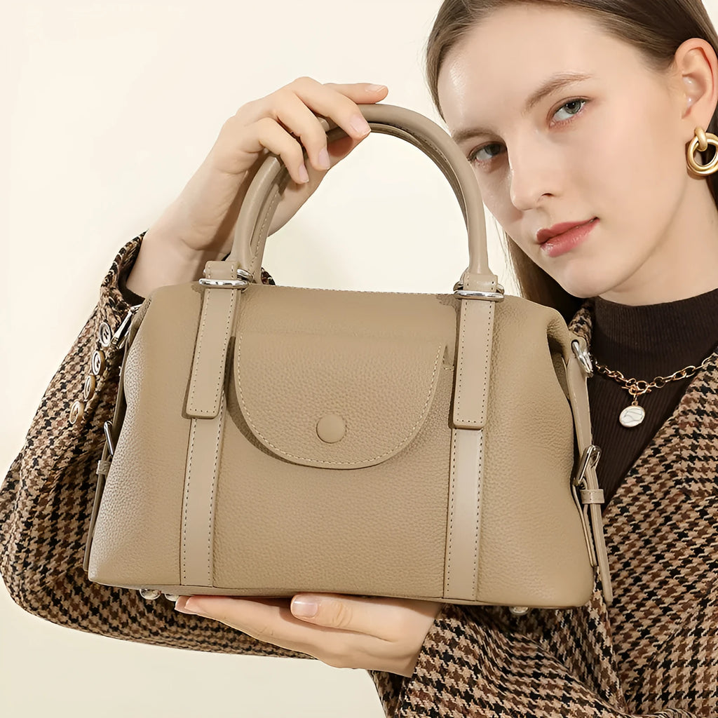 Genuine leather ladies handbag in black, brown, or elephant grey with lock detail and shoulder strap