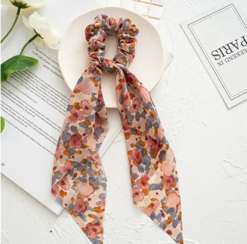 Large intestine ring hair tie with floral bandeau pattern and ribbon decoration in cloth fabric