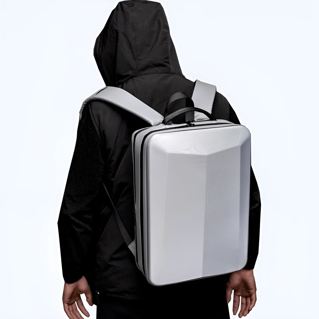 Men's black waterproof business backpack with structured ABS PC shell and curved shoulder straps.