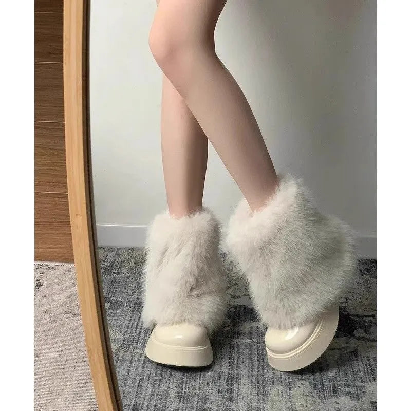 Women's black fleece-lined snow boots with a waterproof rubber platform sole on a white background.
