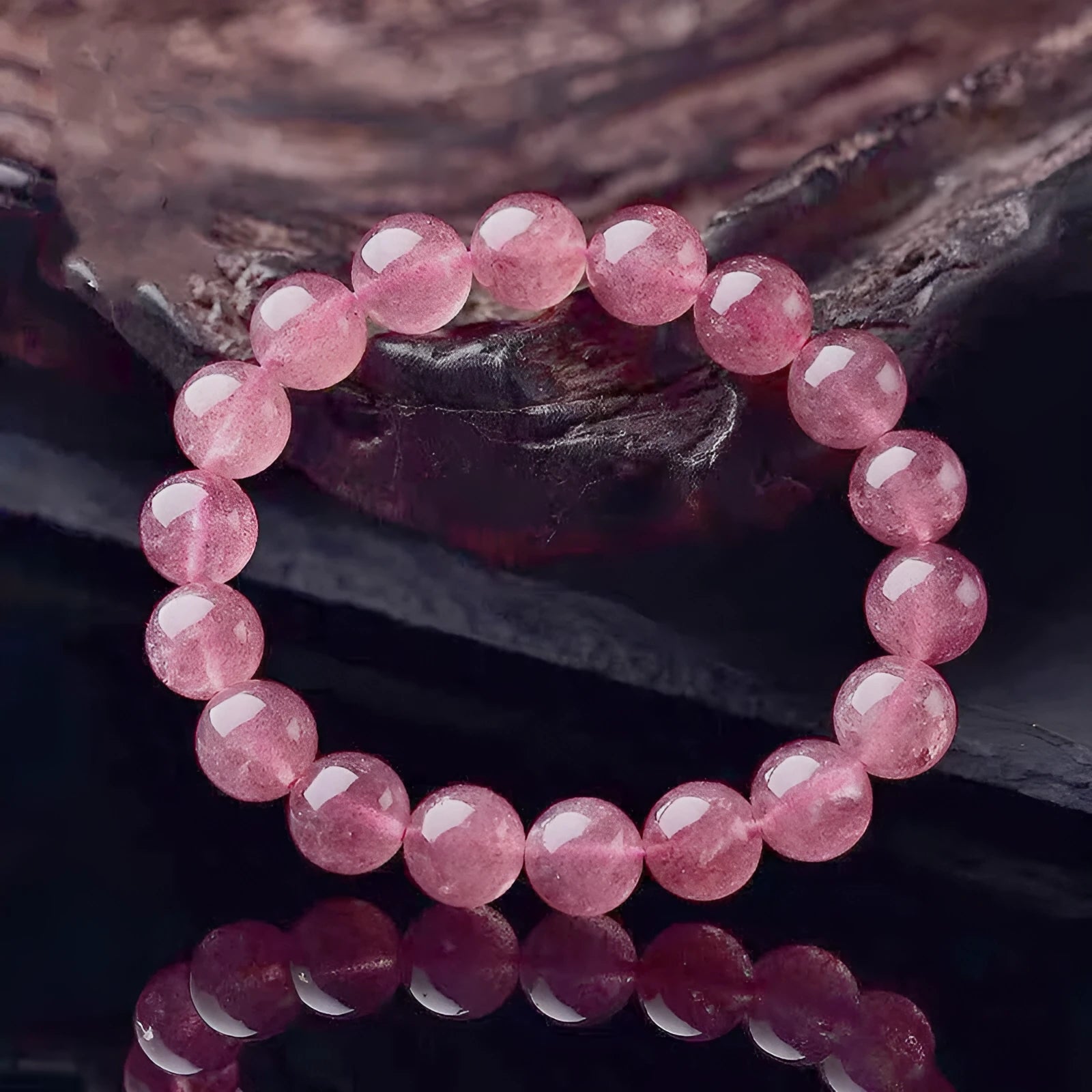 Polished strawberry quartz crystal bracelet for women showing different bead size options