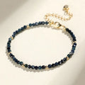 Blue tourmaline beaded bracelet with silver spacer beads and adjustable clasp