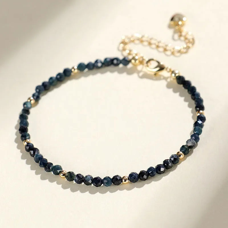 Blue tourmaline beaded bracelet with silver spacer beads and adjustable clasp