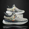Men's white low-top lace-up sneaker with woven mesh upper and flat rubber sole on a neutral background.