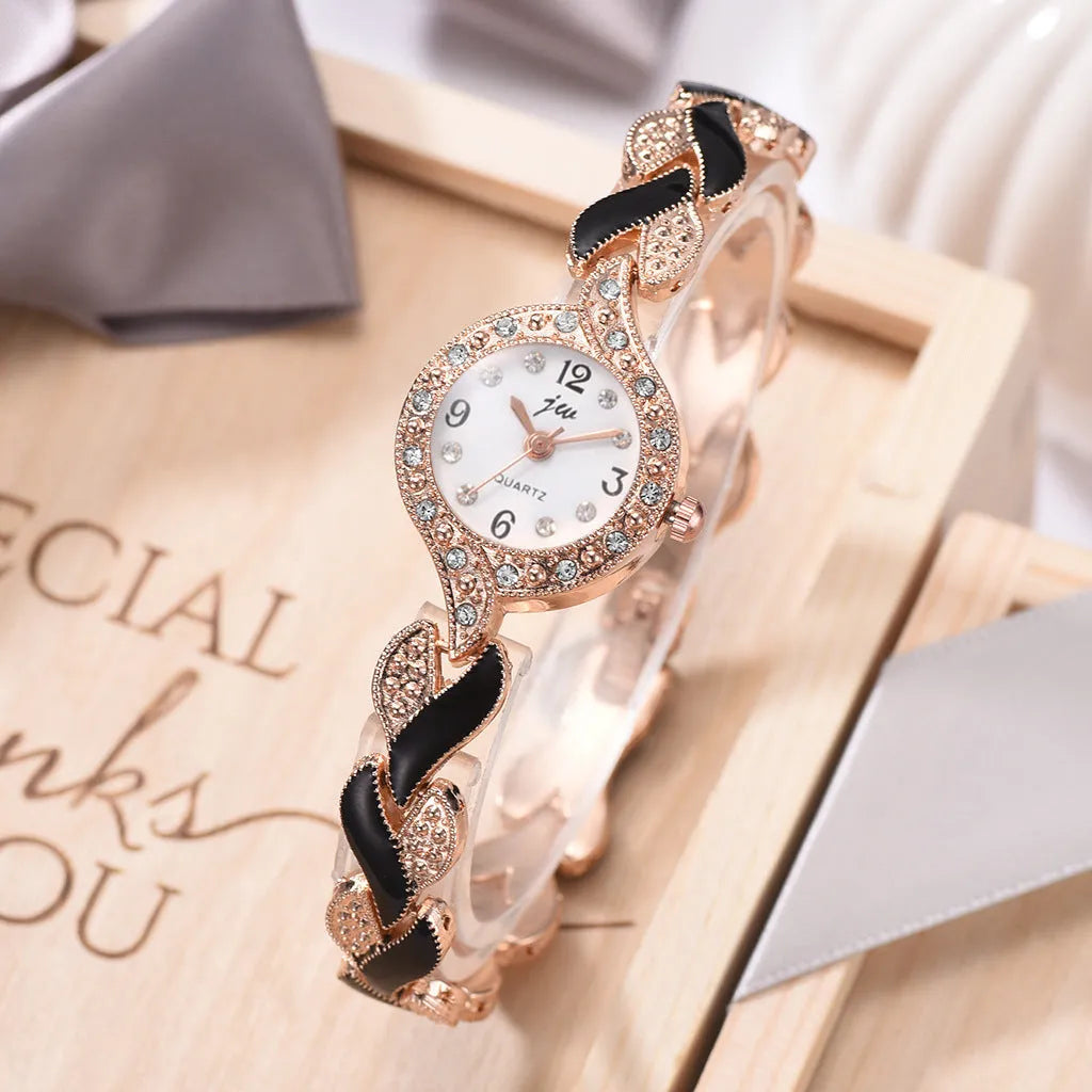 Women's love strap diamond watch with matching earrings, ring, and necklace in black suit option
