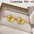 A pair of women's retro-style flower drop earrings with petal details in a gold or silver electroplated finish.