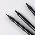 Set of nine wooden drawing pencils with six graphite and three carbonized pencils on suction card packaging