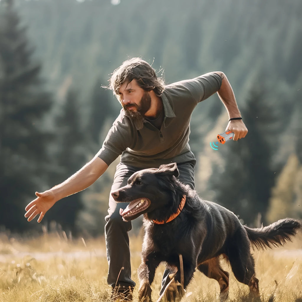Handheld ultrasonic dog trainer with three sound heads in black and orange ABS plastic.