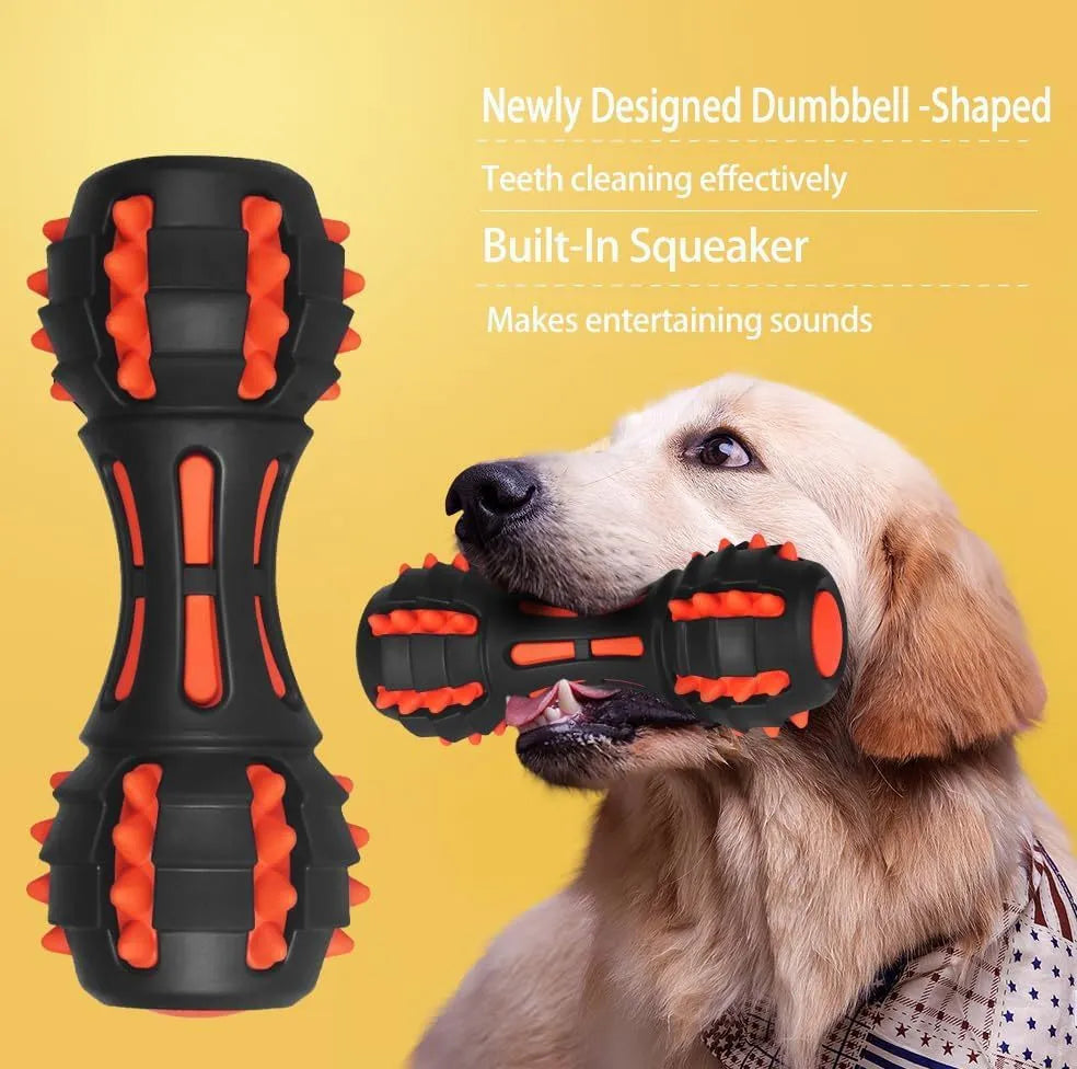 Red dumbbell-shaped durable rubber dog chew toy for aggressive chewers on a plain background.