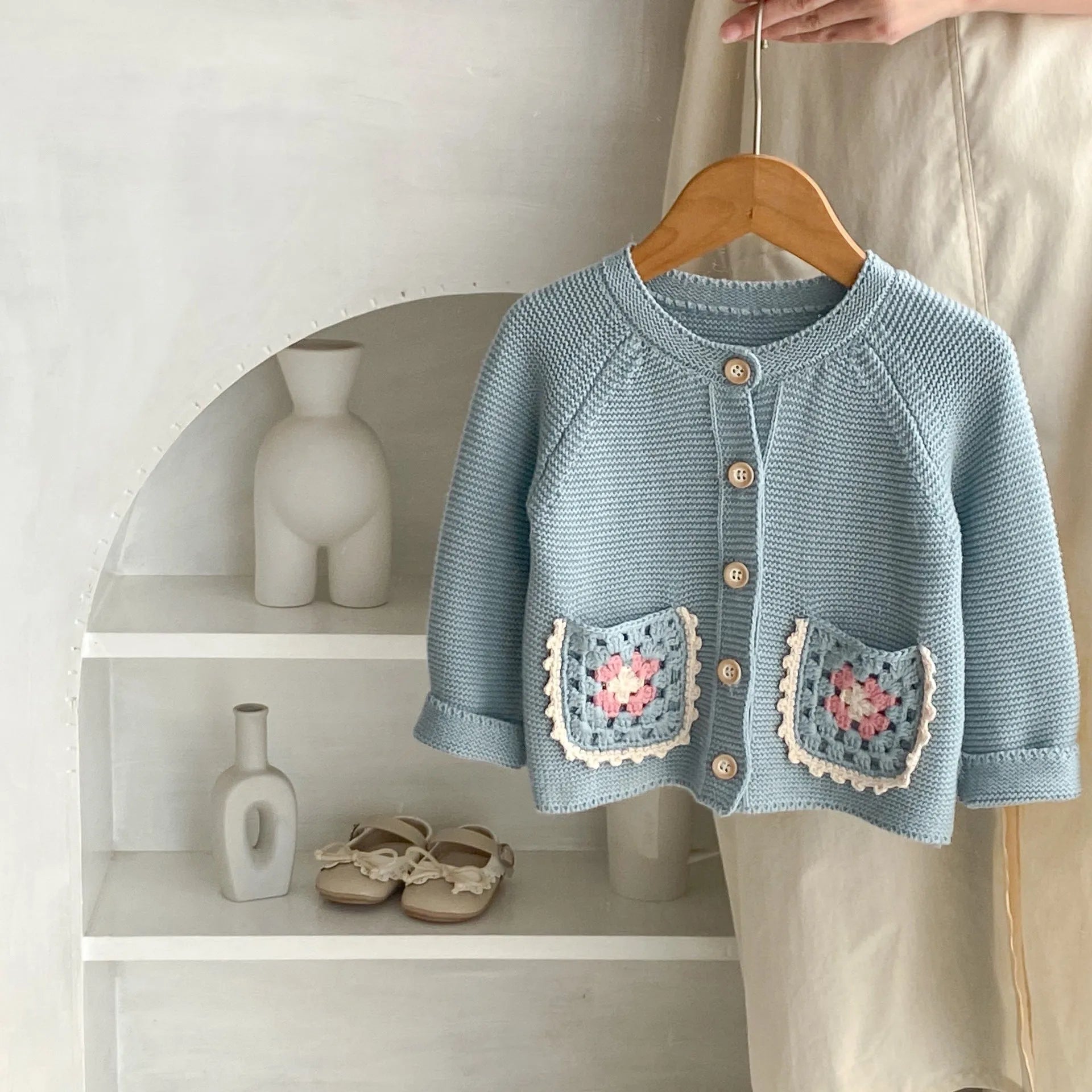 Children's hand crochet cotton cardigan in smokey blue with round collar and hollow flower pocket