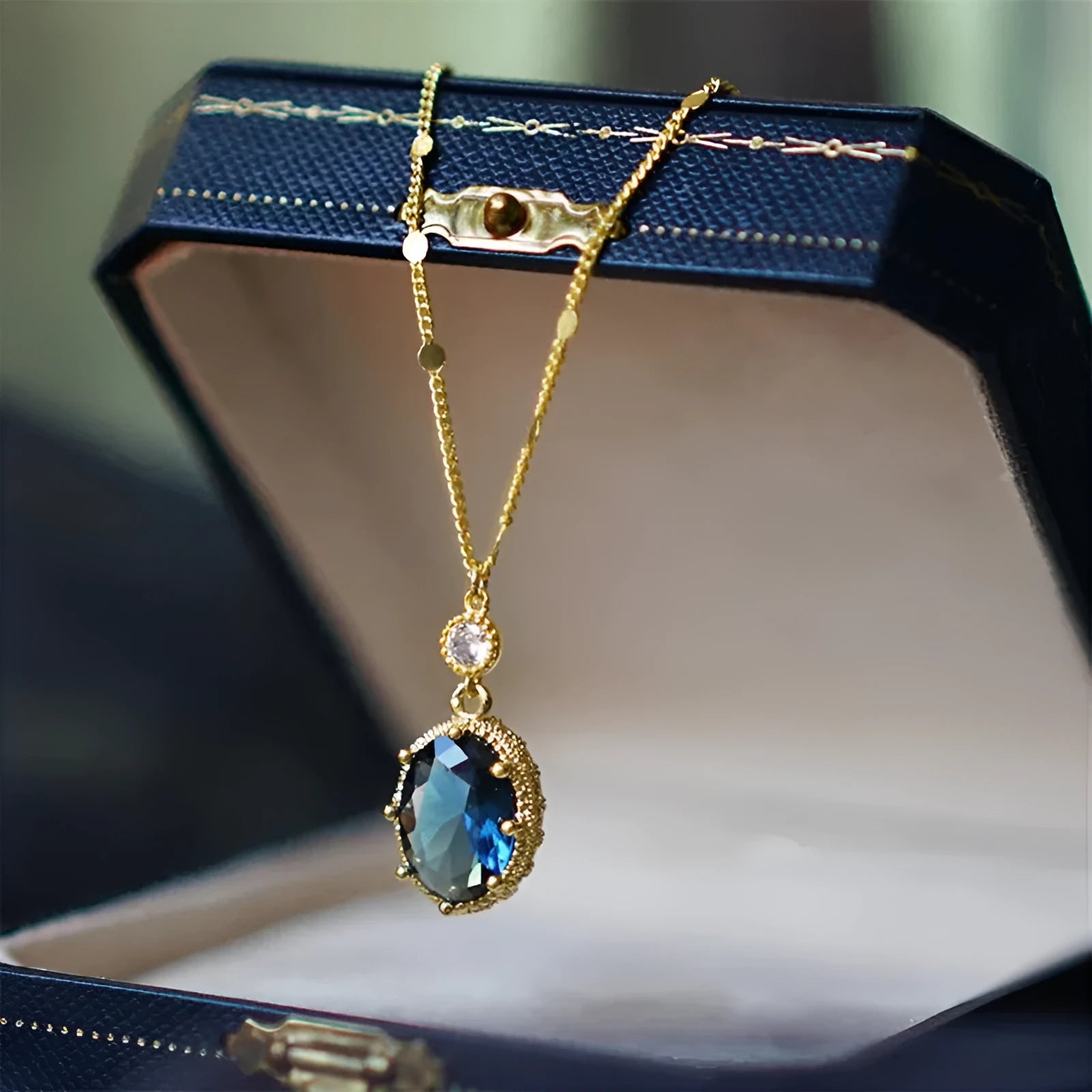 Geometric French retro necklace with electroplated gold colour finish on copper pendant