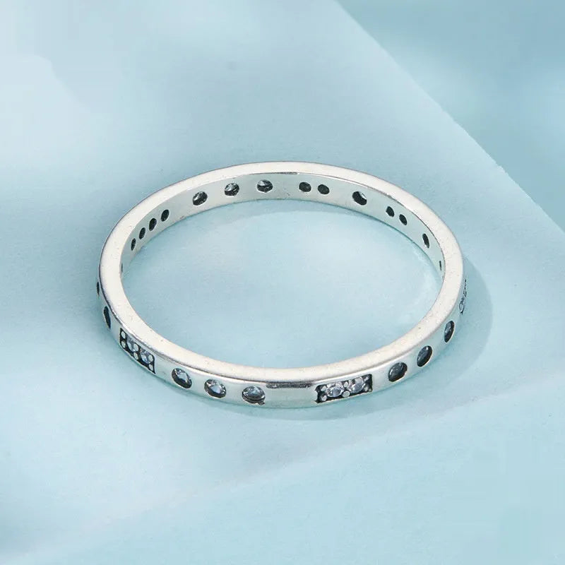 Silver ring with oxidised black moss texture and I Love You engraving on band.
