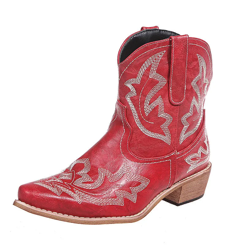 Blue women's cowboy boots with embroidered detail, a low wedge heel, and a pointed toe.