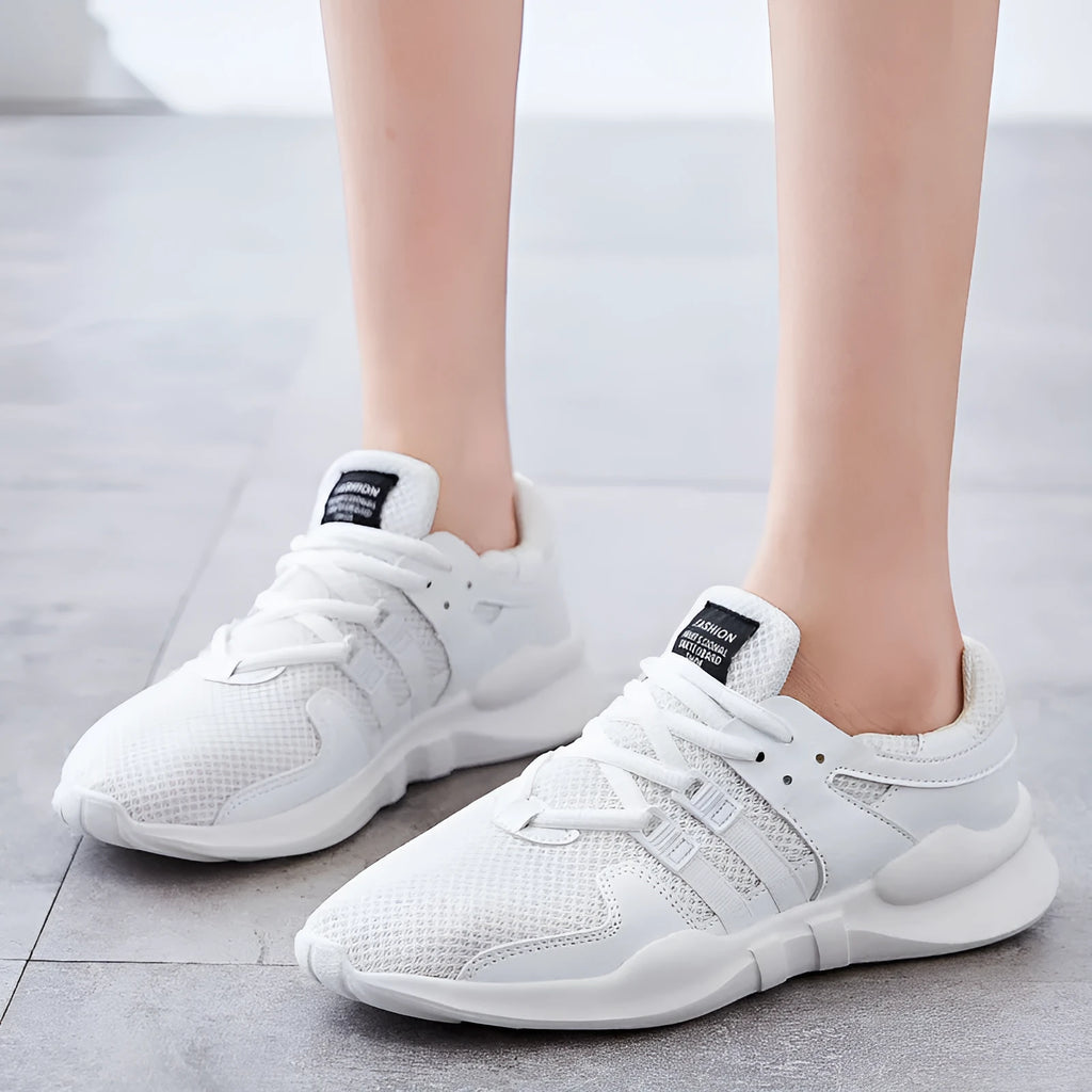 Breathable hollow-out mesh casual sneaker on a white background, showing round toe and slip-on design.