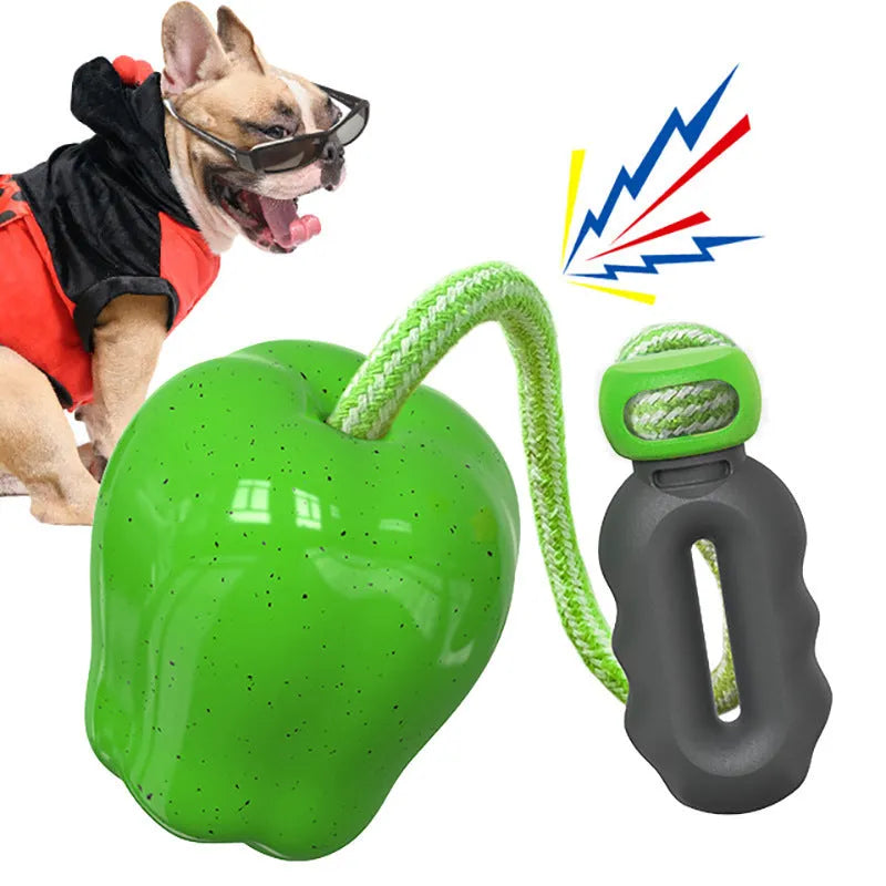 Green plastic dog toy with textured surface and hollow centre for treat insertion
