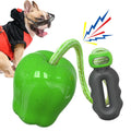 Green plastic dog toy with textured surface and hollow centre for treat insertion