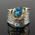 Blue drop-shaped women's ring with inlaid zircon rhinestones on an alloy band.