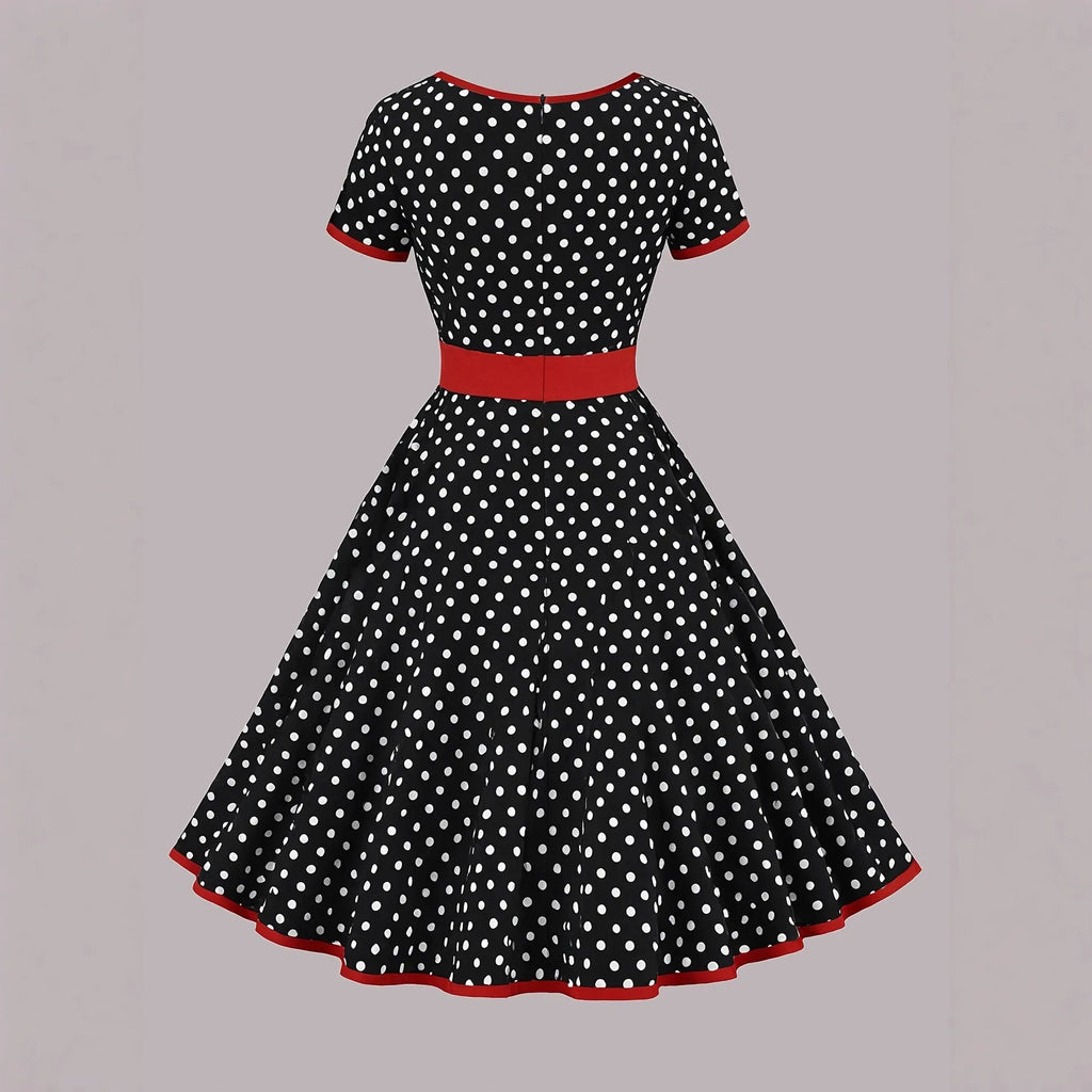 Women's mid-length polka dot dress with square collar, front zip, and pleated skirt